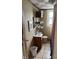 Small bathroom with a sink and mirror at 408 N Colorado Ave, Indianapolis, IN 46201