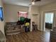 Neutral bedroom with hardwood floors, ceiling fan, closet, and window at 408 N Colorado Ave, Indianapolis, IN 46201