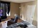 Bedroom featuring a bed, TV and chair at 408 N Colorado Ave, Indianapolis, IN 46201