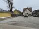 Exterior view showcasing the home's spacious parking and backyard at 408 N Colorado Ave, Indianapolis, IN 46201