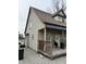 Home featuring a charming covered porch and a well-maintained exterior at 408 N Colorado Ave, Indianapolis, IN 46201