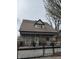 Inviting exterior view showcasing the front porch and charming architectural details at 408 N Colorado Ave, Indianapolis, IN 46201