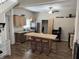 Open kitchen with a brick-accented island with bar stool seating at 408 N Colorado Ave, Indianapolis, IN 46201