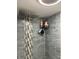 Modern bathroom shower with gray tile and decorative mosaic accent wall at 408 N Colorado Ave, Indianapolis, IN 46201