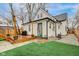 Backyard featuring a wooden deck, small grass patch, and the exterior of the home at 415 S Oxford St, Indianapolis, IN 46201