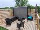 Cozy backyard deck with comfortable seating, privacy screening, and stylish decor, perfect for relaxing and entertaining at 415 S Oxford St, Indianapolis, IN 46201