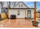Backyard with wooden deck, a grill, small artificial grass patch, and the back of the house at 415 S Oxford St, Indianapolis, IN 46201