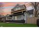 Beautiful home featuring a rooftop deck, newly painted exterior, and well-kept front yard at 415 S Oxford St, Indianapolis, IN 46201