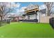 Attractive two-story home featuring a black brick foundation and a well-manicured, fenced front yard at 415 S Oxford St, Indianapolis, IN 46201