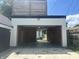 A clean two car garage with white trim featuring access to the backyard at 415 S Oxford St, Indianapolis, IN 46201