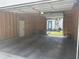 Spacious two car garage featuring concrete floor and unfinished walls at 415 S Oxford St, Indianapolis, IN 46201