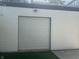 White two-car garage exterior with green grass in the foreground at 415 S Oxford St, Indianapolis, IN 46201