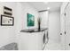 Well-lit laundry room with modern washer and dryer, white cabinets, and a sleek countertop at 415 S Oxford St, Indianapolis, IN 46201