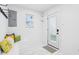 Bright mudroom featuring a bench, coat hooks, and easy access to the outdoors at 415 S Oxford St, Indianapolis, IN 46201