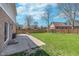 Spacious backyard with a wood fence and green lawn at 4421 Brittany Dr, Zionsville, IN 46077