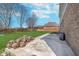 Lush green backyard with a wood fence and patio area at 4421 Brittany Dr, Zionsville, IN 46077