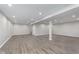 Finished basement with modern gray floors and neutral paint at 4421 Brittany Dr, Zionsville, IN 46077