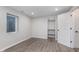Finished basement with window, closet, and modern gray floors at 4421 Brittany Dr, Zionsville, IN 46077