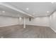 Spacious basement featuring light gray wood-look flooring at 4421 Brittany Dr, Zionsville, IN 46077