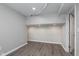 Finished basement view with modern flooring and neutral paint at 4421 Brittany Dr, Zionsville, IN 46077