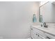 Well-lit bathroom with a white vanity, sleek black faucet, and modern mirror at 4421 Brittany Dr, Zionsville, IN 46077