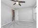 Comfortable bedroom with ceiling fan, neutral walls, and plush carpeting at 4421 Brittany Dr, Zionsville, IN 46077