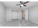 Spacious bedroom with plush carpet, ceiling fan, closet, and ample natural light at 4421 Brittany Dr, Zionsville, IN 46077