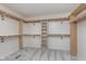 Large walk-in closet with custom shelving and ample storage space at 4421 Brittany Dr, Zionsville, IN 46077
