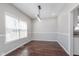 Inviting dining room with hardwood flooring, natural light, and stylish lighting for a modern touch at 4421 Brittany Dr, Zionsville, IN 46077