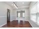Open dining room flows into the kitchen area, hardwood floors, and natural light making an inviting area at 4421 Brittany Dr, Zionsville, IN 46077