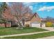 Charming brick home with a well-manicured lawn and mature tree at 4421 Brittany Dr, Zionsville, IN 46077