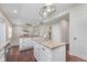 Bright open kitchen with island, stainless steel appliances, and white cabinetry at 4421 Brittany Dr, Zionsville, IN 46077