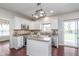 Open kitchen layout with stainless steel appliances and granite countertops at 4421 Brittany Dr, Zionsville, IN 46077