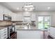 Kitchen features an island, stainless steel appliances, and lots of cabinet space at 4421 Brittany Dr, Zionsville, IN 46077