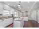 Spacious kitchen with island opens to cozy living area with fireplace at 4421 Brittany Dr, Zionsville, IN 46077
