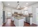 Modern kitchen with granite countertops, stainless steel appliances, and hardwood floors at 4421 Brittany Dr, Zionsville, IN 46077