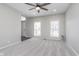 Bright living room featuring neutral walls, plush carpeting, and natural light from multiple windows at 4421 Brittany Dr, Zionsville, IN 46077