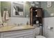 Bathroom featuring marble counter, white wainscoting and rustic storage cabinet at 443 S Arlington Ave, Indianapolis, IN 46219