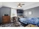 Bedroom with a desk area, comfy chair, and ample storage space at 443 S Arlington Ave, Indianapolis, IN 46219