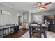 Dining room features an area rug, a long table with chairs, and natural light at 443 S Arlington Ave, Indianapolis, IN 46219