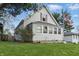 Charming gray home with well-maintained lawn and inviting curb appeal at 443 S Arlington Ave, Indianapolis, IN 46219