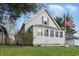 Charming gray home with well-maintained lawn and inviting curb appeal at 443 S Arlington Ave, Indianapolis, IN 46219