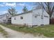 View of the exterior of the detached single car garage with white door at 443 S Arlington Ave, Indianapolis, IN 46219