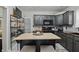 Cozy kitchen boasts a wooden island, pendant lighting, and modern appliances at 443 S Arlington Ave, Indianapolis, IN 46219
