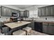 Cozy kitchen with island, dark cabinets, wood countertops, and stainless steel appliances at 443 S Arlington Ave, Indianapolis, IN 46219