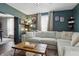 Comfortable living room with a large sectional sofa, perfect for relaxing at 443 S Arlington Ave, Indianapolis, IN 46219