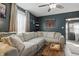 Comfortable living room with a large sectional sofa, perfect for relaxing at 443 S Arlington Ave, Indianapolis, IN 46219