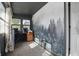 Sunroom features large window, built in desk area and scenic forest mural at 443 S Arlington Ave, Indianapolis, IN 46219