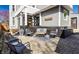 Inviting back patio with stylish outdoor seating, a textured rug, and charming 'Welcome' sign at 4849 Central Ave, Indianapolis, IN 46205