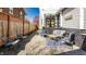 Inviting outdoor patio with stylish seating, a textured rug, and a welcoming atmosphere perfect for relaxation at 4849 Central Ave, Indianapolis, IN 46205